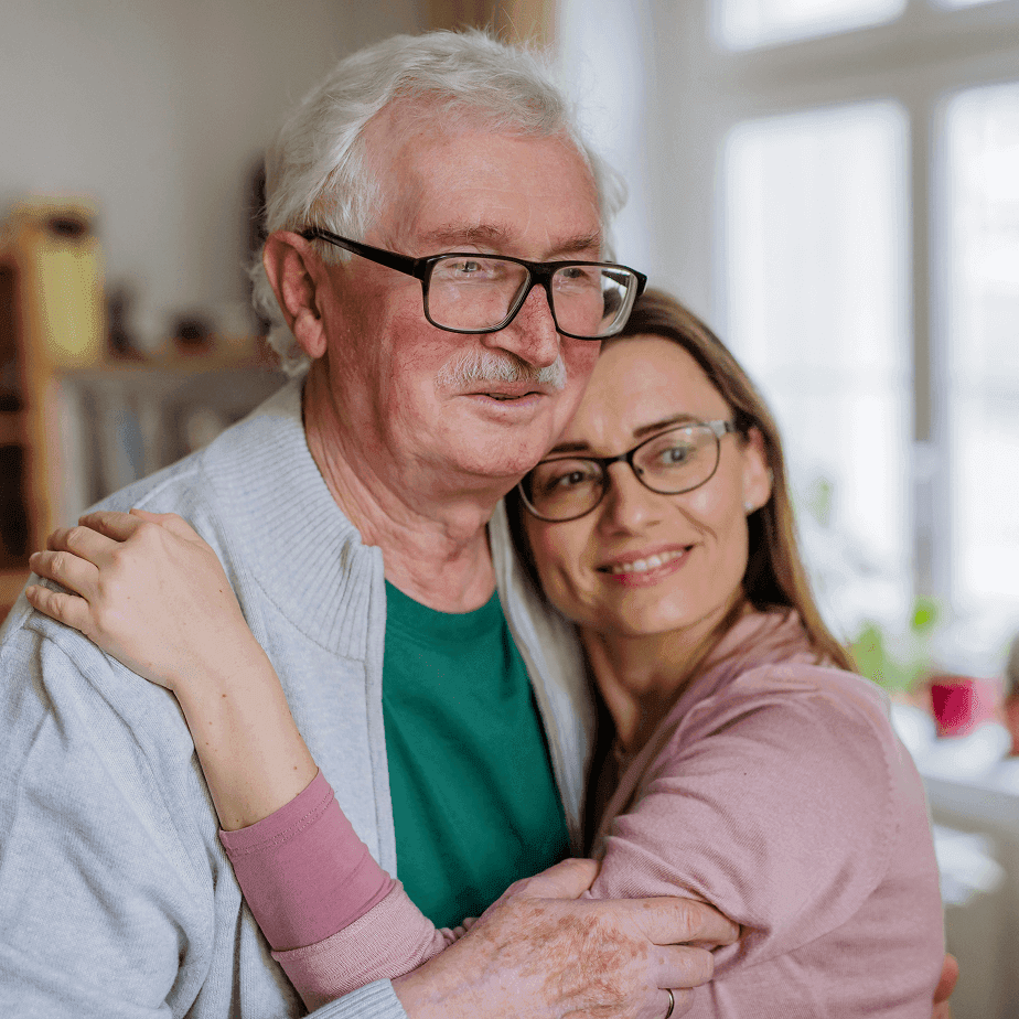 Older couple embracing and smiling