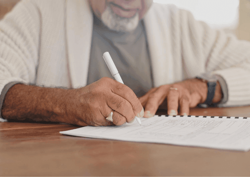 Elder man hand writing